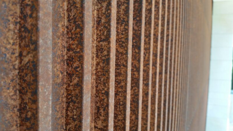 Sectional Overhead Door CNC routed Axolotl brown rust detail