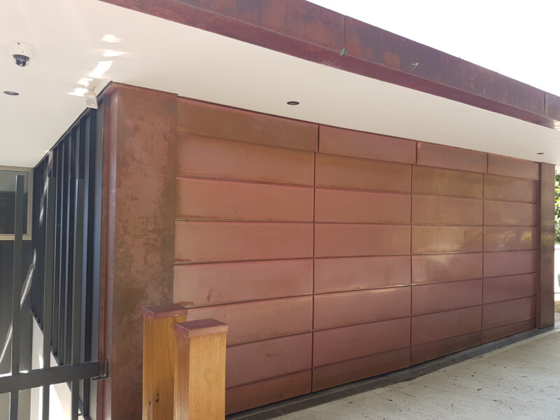 Sectional Overhead Door mill finish copper expressed vertical and horizontal joins